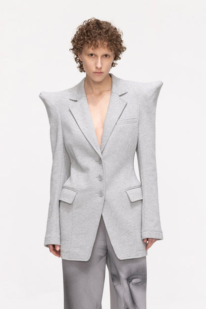 Shoulder shrugging and waist tightening suit jacket